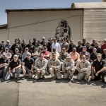 Members pose for a group photo in front of the Shadowman at Scout Sniper School, Camp Pendleton, California